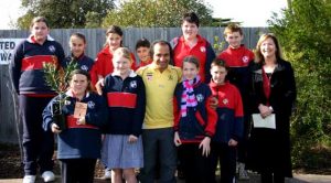 Planting tree in Grovedale primery school in Geelong